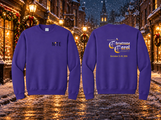 Purple crewneck sweatshirt with NITE theatre logo an the front left chest and A Christmas Carol production logo on the back with a snowy holiday street in the background